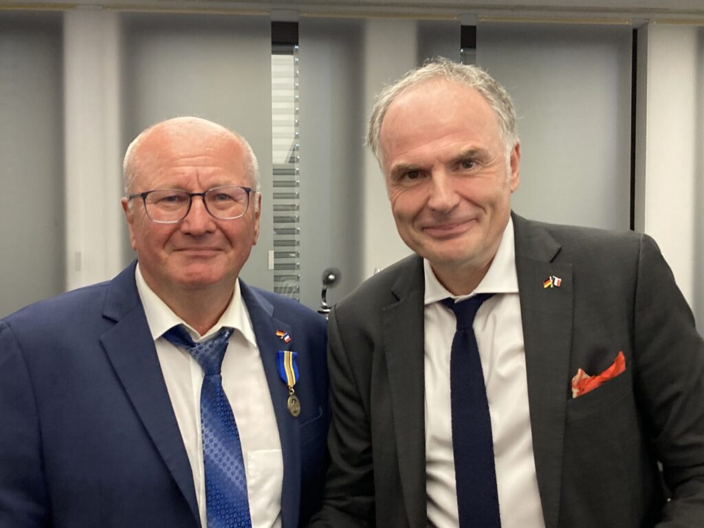Das Bild zeigt Frank Eloy und Jérôme Spinoza